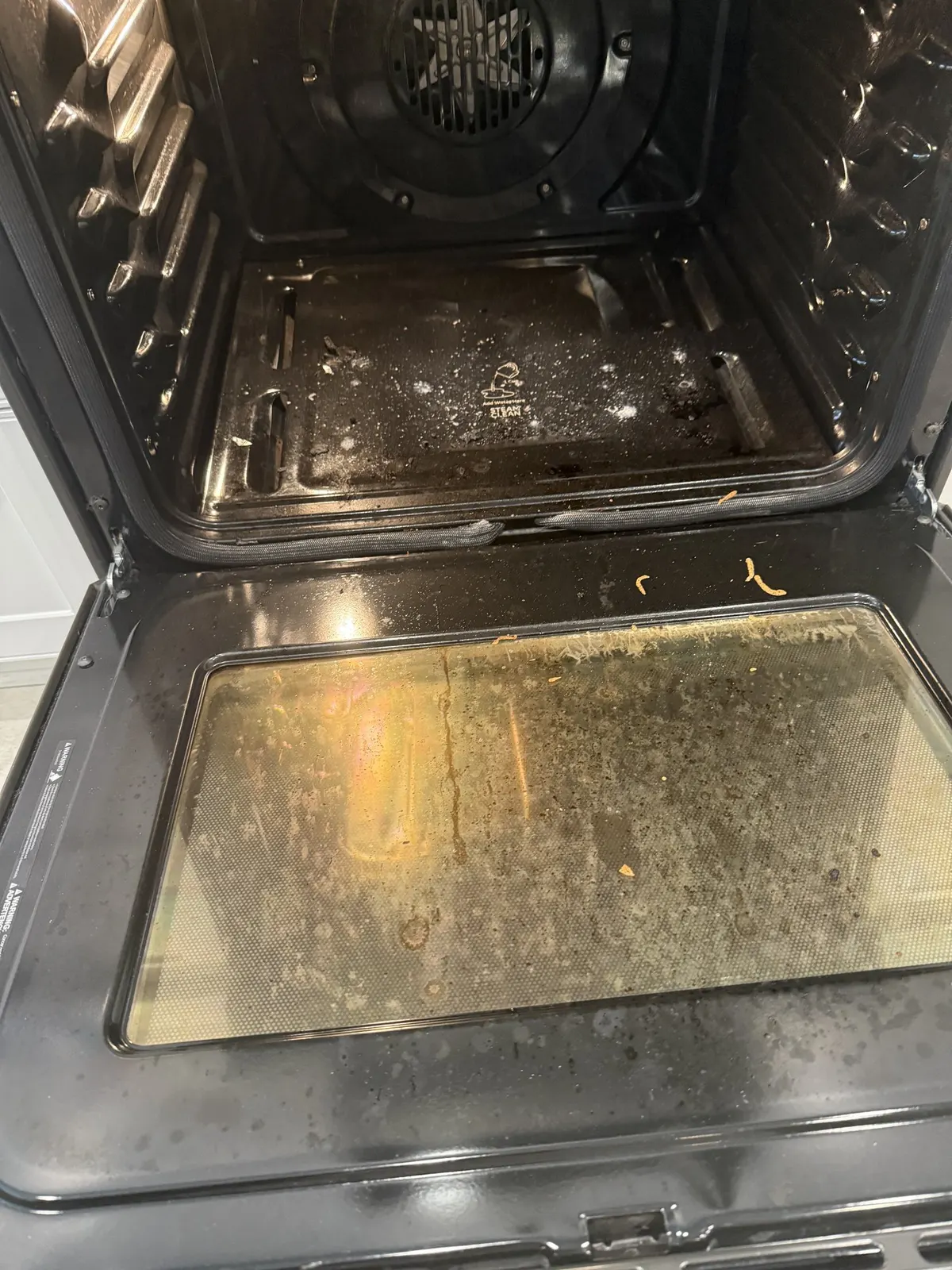 Oven door glass, before cleaning